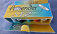 Packaging for a sewing kit featuring the words ‘Amender: Everything you need for on-the-go-mending’ with a thread spool and buttons being threaded.